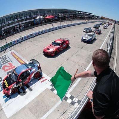 Race cars finish line checkered flag.