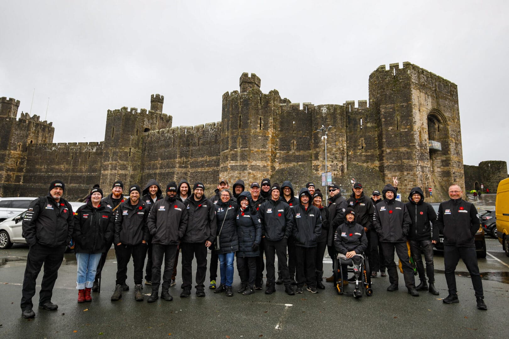 Group of people in front of a castle.