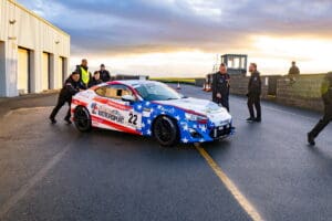 White race car with American flag design.